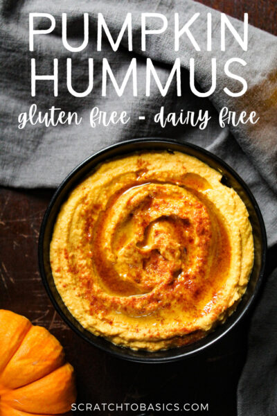 overhead shot of pumpkin hummus in black bowl