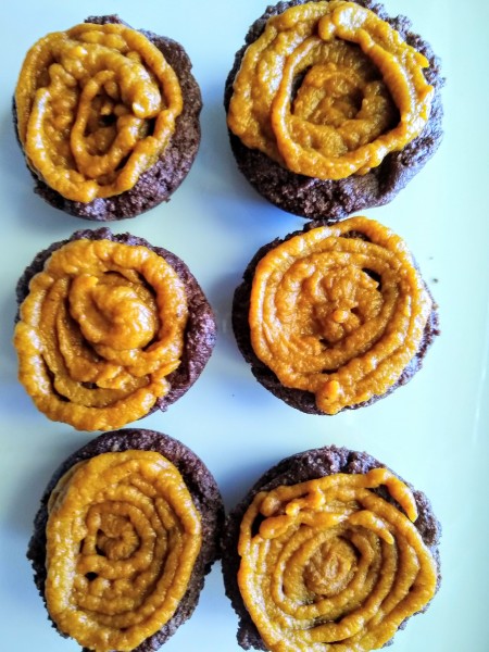 Add a layer of pumpkin spice puree to the top of the brownies before the chocolate frosting.