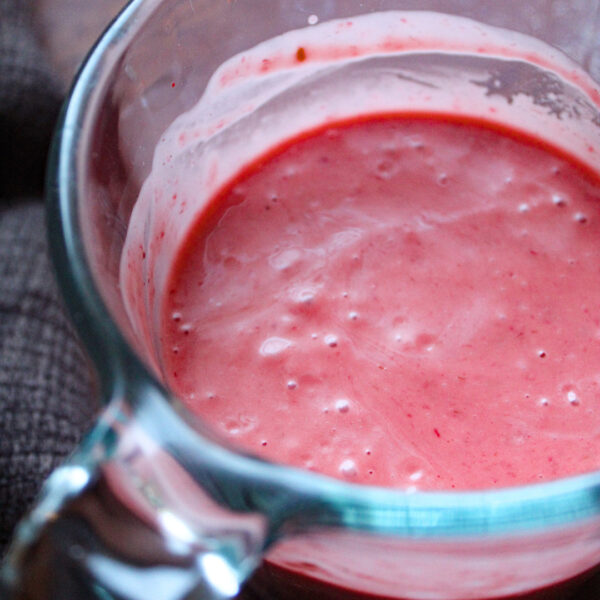 raspberry vinaigrette dressing on a glass pan