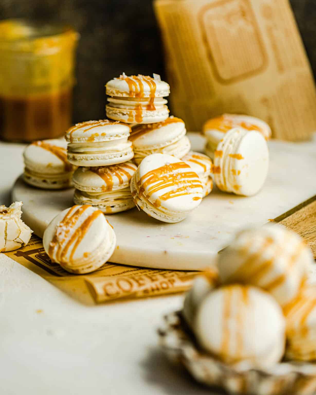 white macarons drizzled with caramel