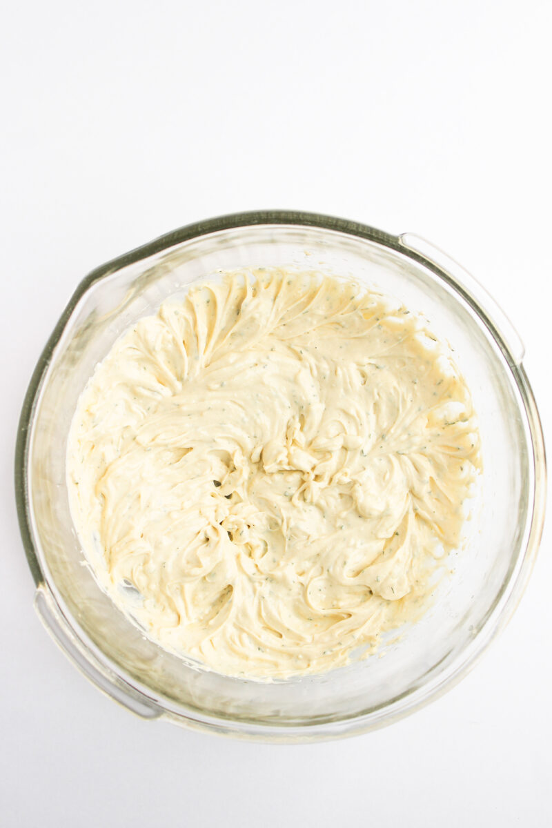 Sauce for chicken salad in clear bowl.