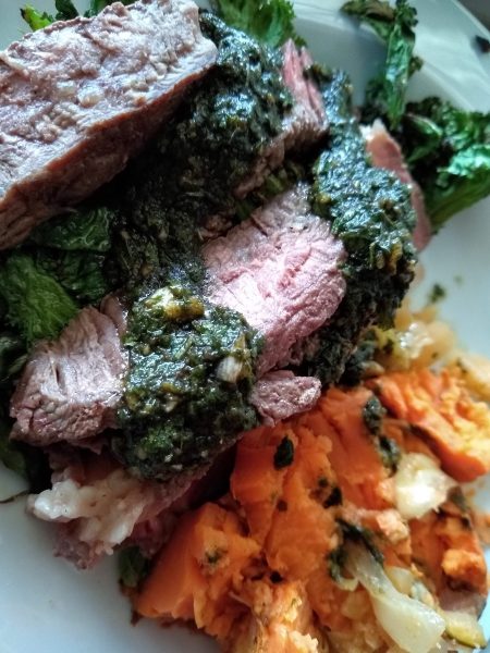 Flank steak with roasted sweet potatoes and chimichuri sauce