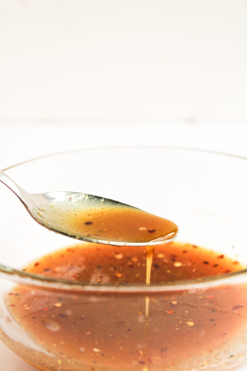 Sauce in clear bowl with spoon