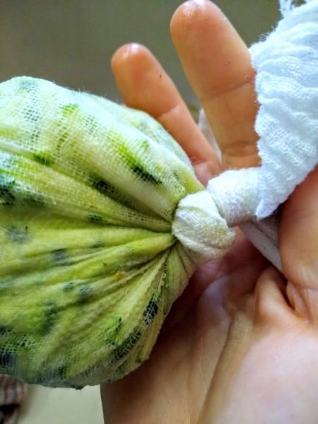 Wring out liquid from zucchini in cheesecloth