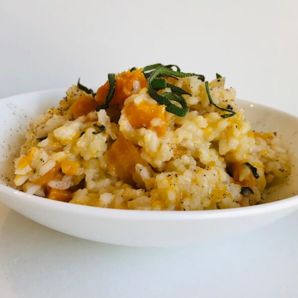 cooked pumkin with rice and herbs in a plate-bowl