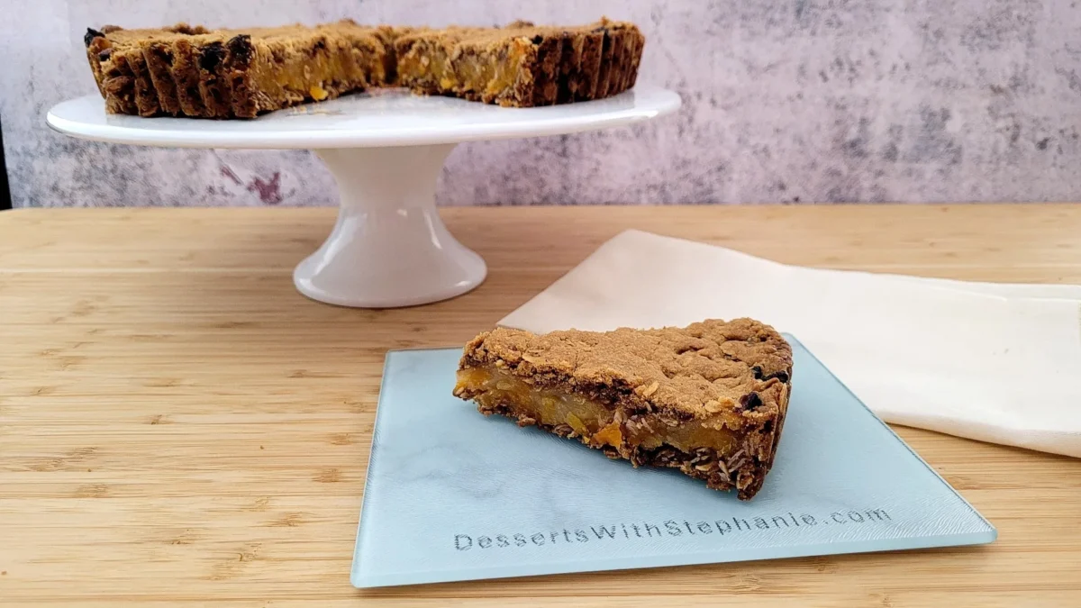 sliced whole oatmeal bars on a white cake turntable