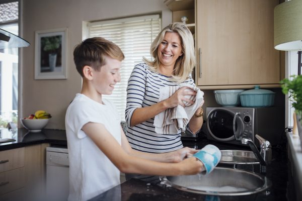 mom and son washing dishes